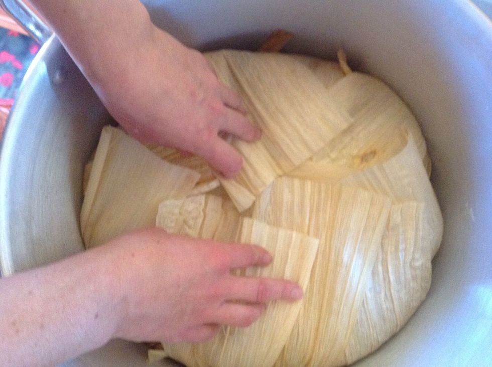 Fold more empty husks over the sides and tops.