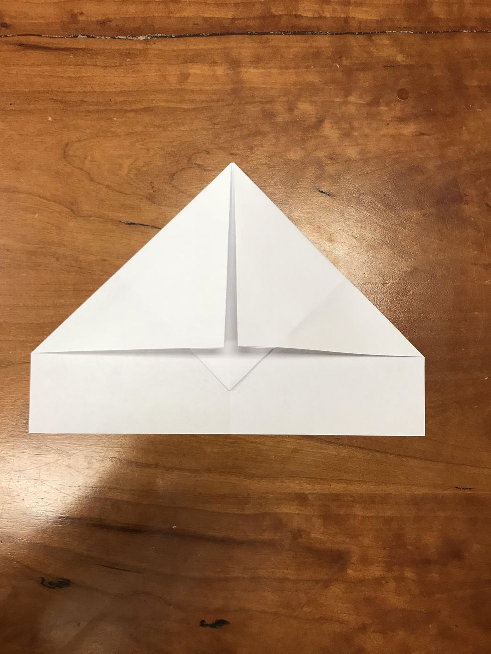 Fold new top corners to center line
