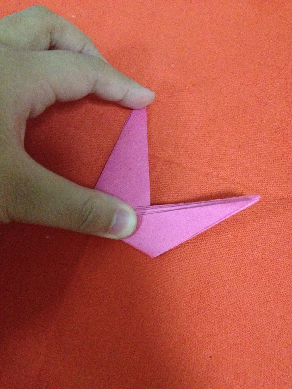 Fold on the crease line.