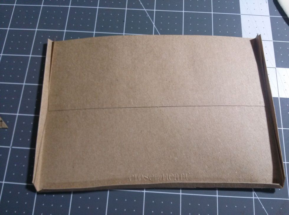 Fold on the score lines and crease well.