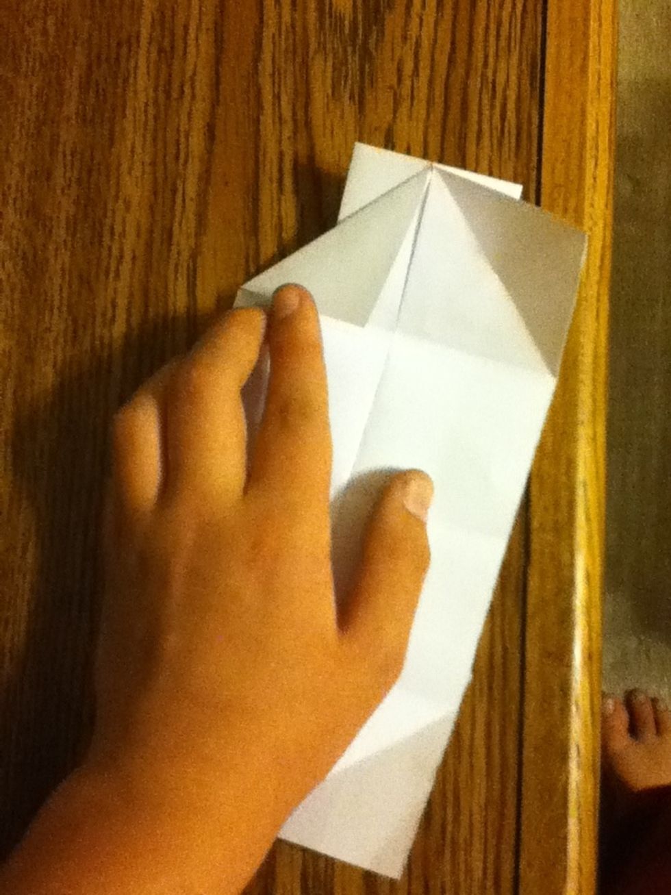 Fold one corner down like this