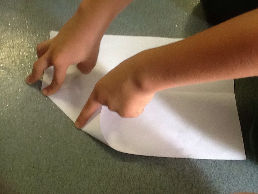 Fold one corner down to the seam.
