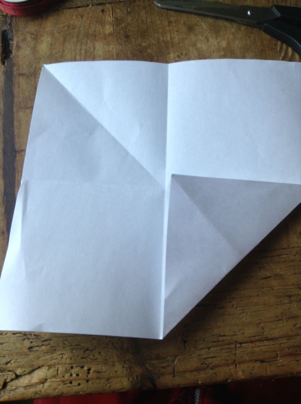 Fold one corner into the middle