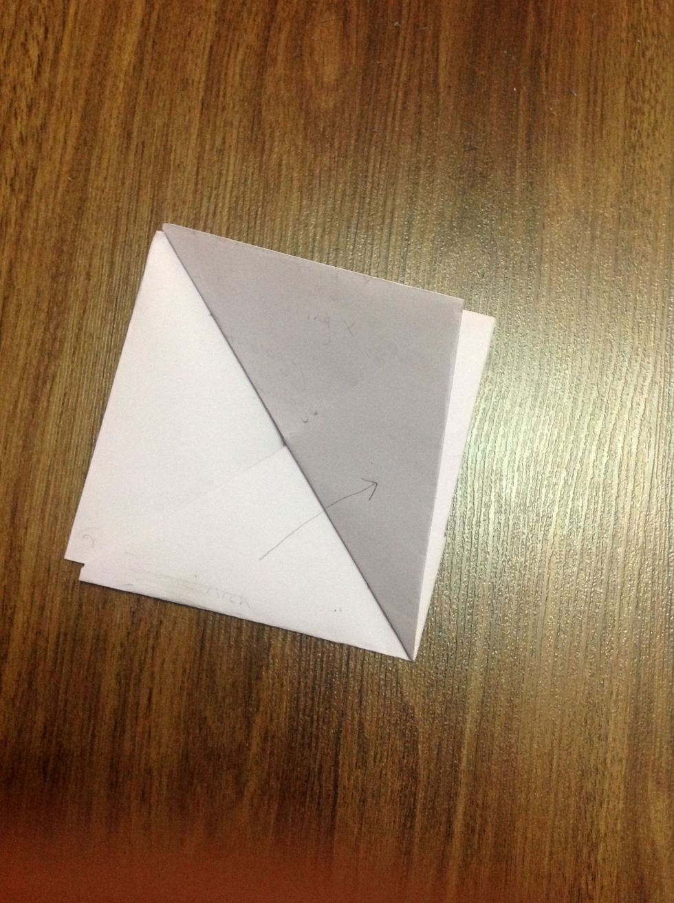 Fold one corner of the square making a triangle