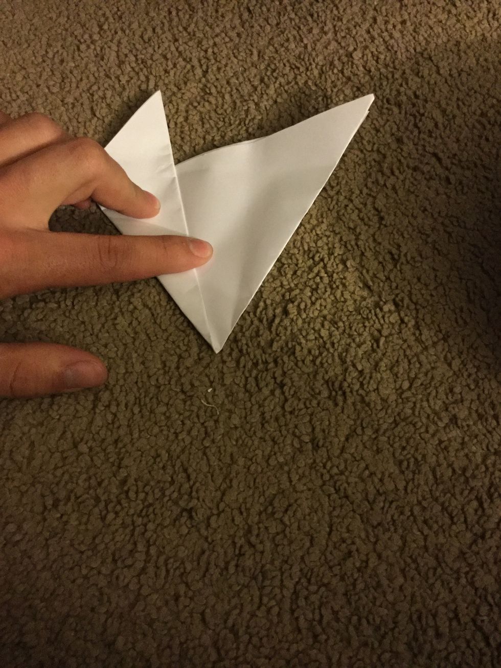 Fold one corner to the middle.