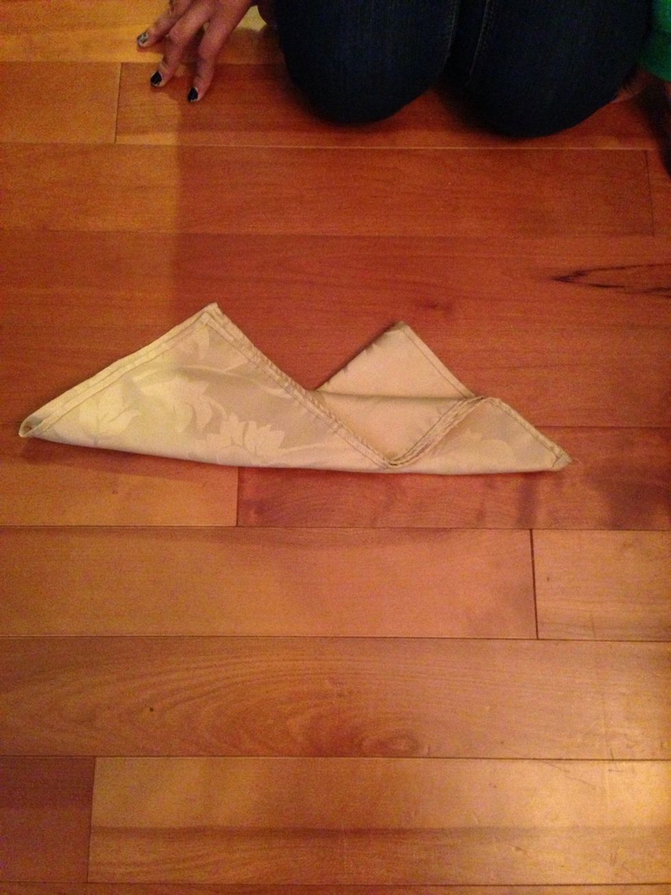 Fold one corner upwards and ripple it.