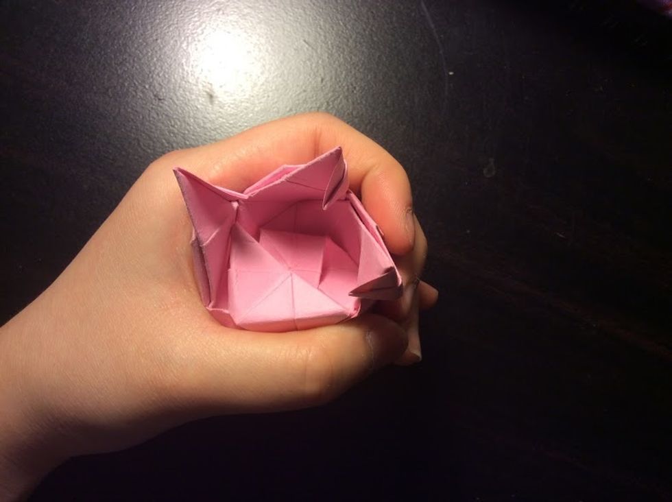 Fold one flap down and rotate it, repeating the steps for the rest of the flaps.