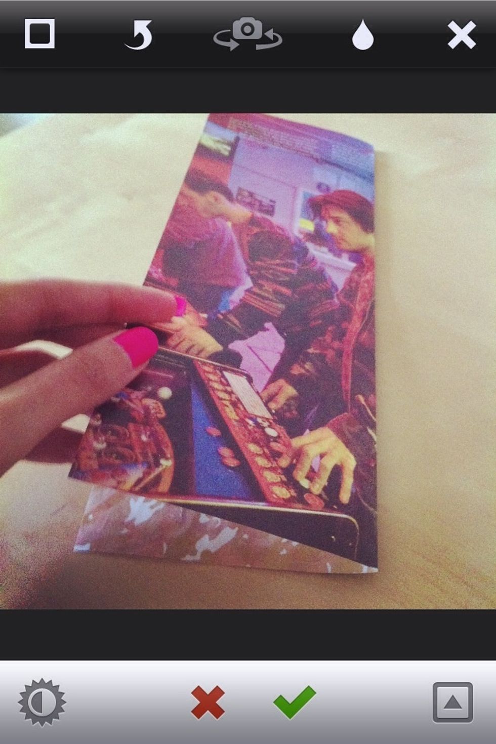 Fold one page in half then using your scissors cut it at where it folds.