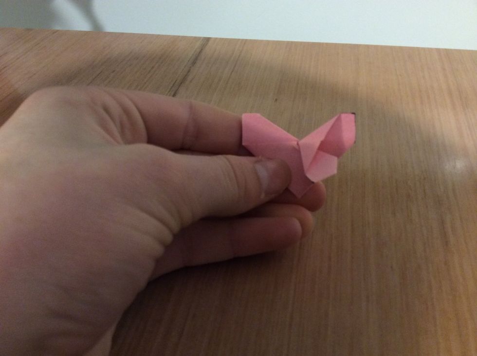 Fold one side down.