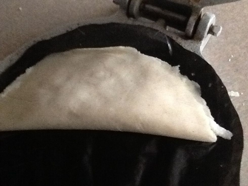 Fold one side if the tortilla over like this pressing all along the sides