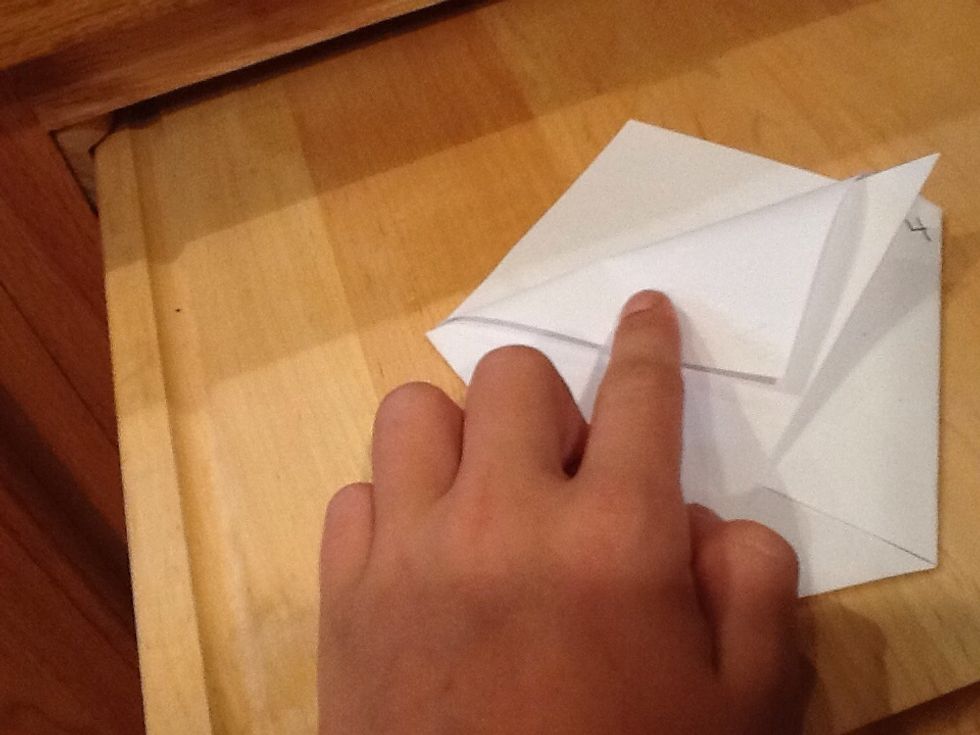 Fold one side of 2 down as far as it can go.