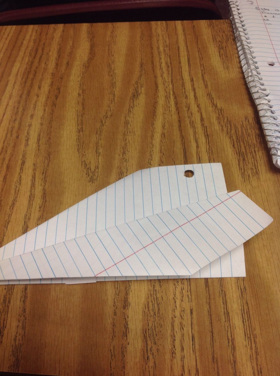 Fold one side of the wing as shown, make sure it lines up with the bottom of the plane