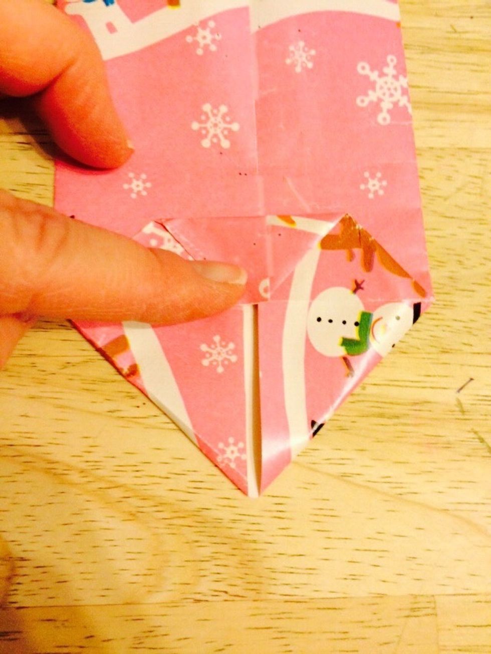 Fold one side to middle.