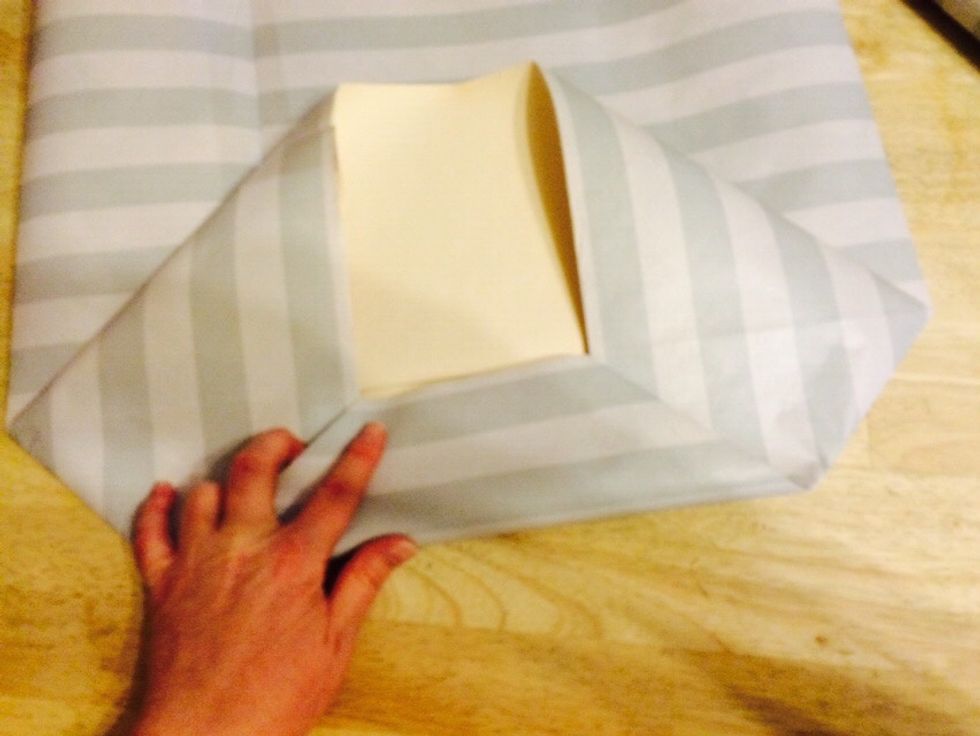 Fold one side to the middle.