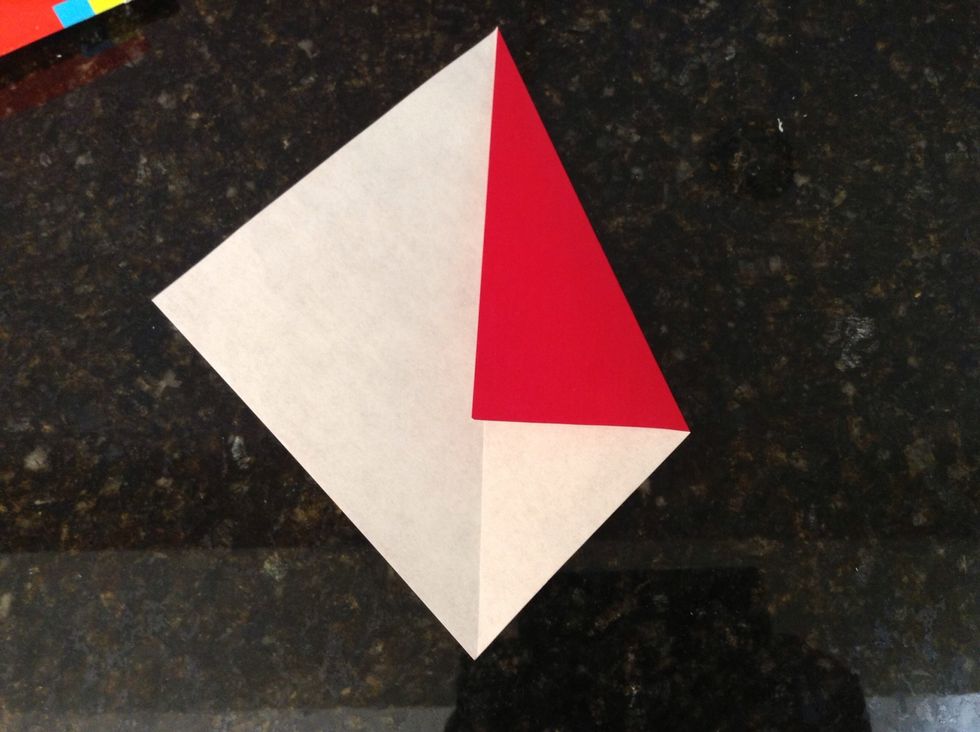 Fold one top side edge to meet the center line.