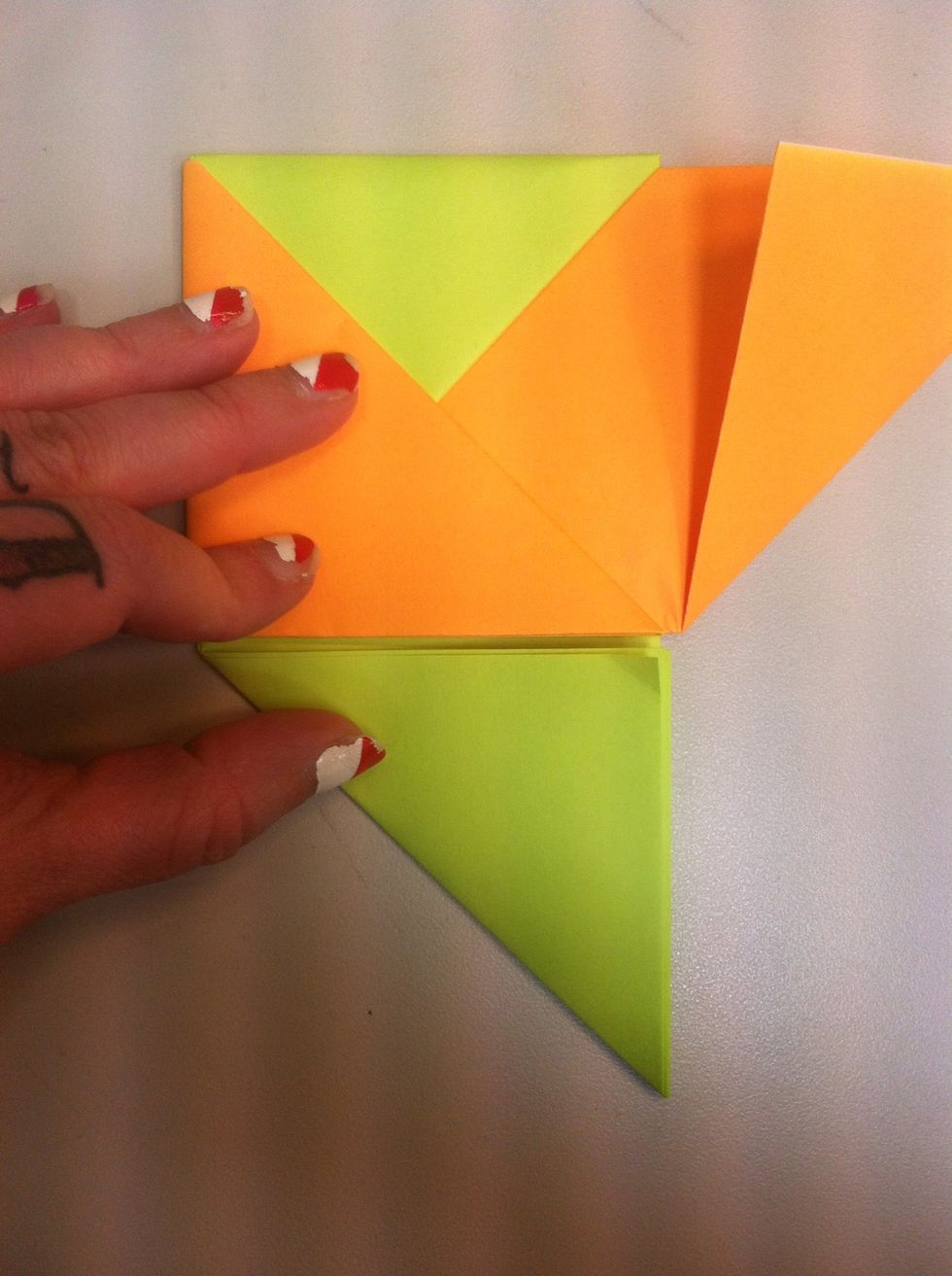Fold orange triangle over green.