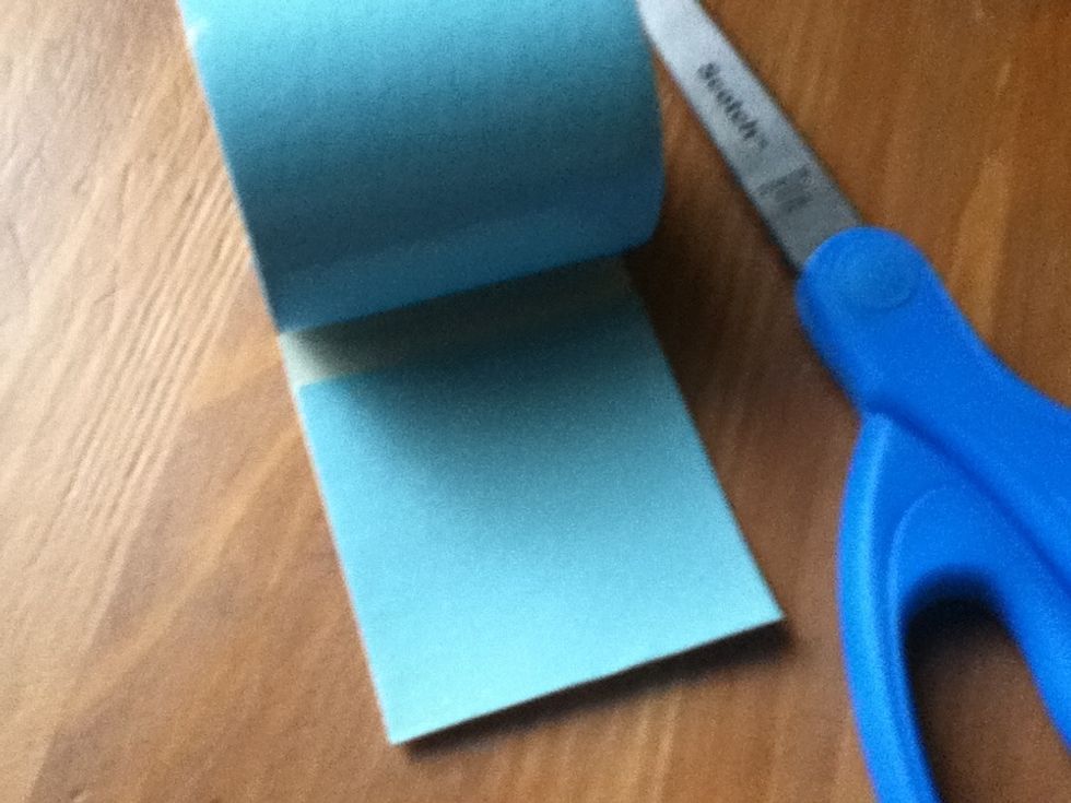 Fold over tape to make a squarish square, and cut it out.