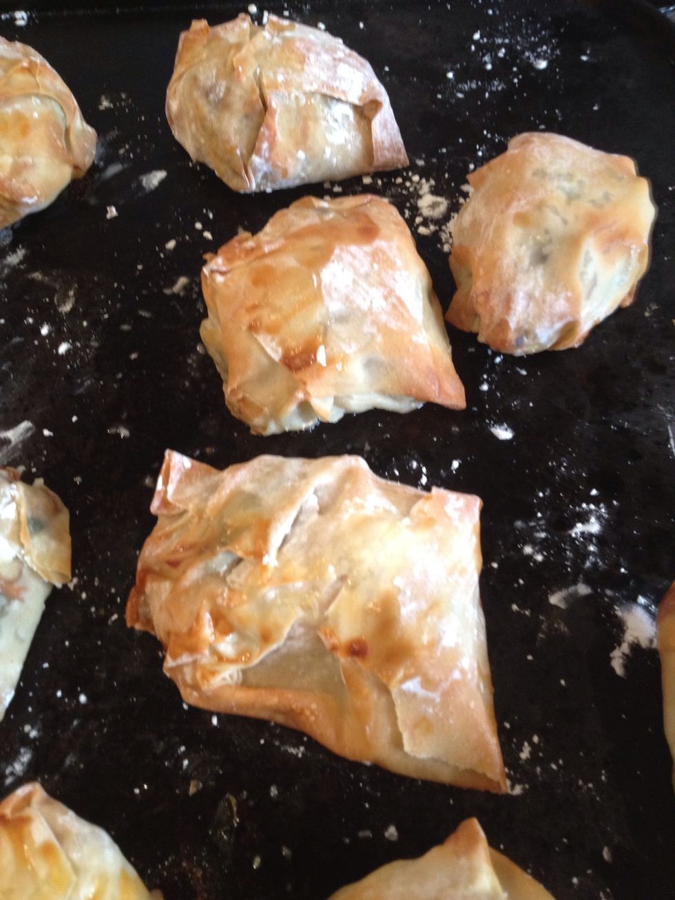 Fold over the corners of the filo square and dab the top of the pastry to help seal the parcel. Now place the parcels on a lightly dusted baking tray and cook for 17mins at 200c.