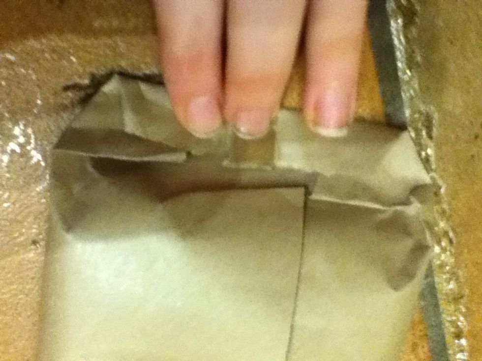 Fold over the end towards the middle.