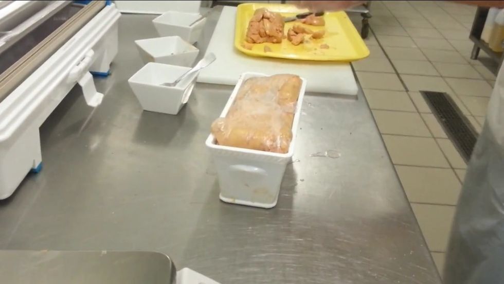 Fold over the excess plastic wall lining of the terrine.