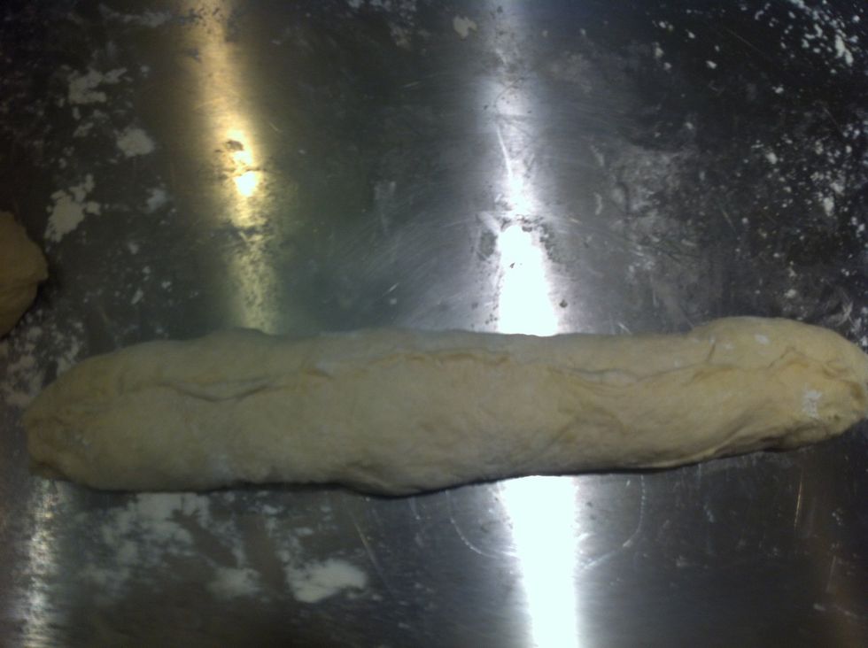 Fold over the other 1/3 and pinch closed the seam. The seam goes on the bottom of the loaf.