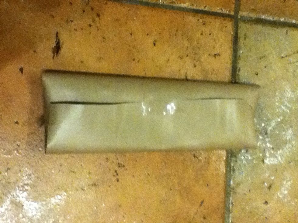 Fold over the two wider sides, leaving gaps at each end. Tape it up.