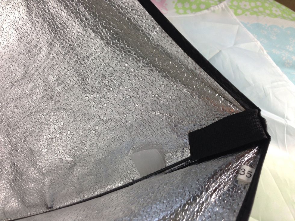 Fold over the Velcro to hide the pin and secure it in place.