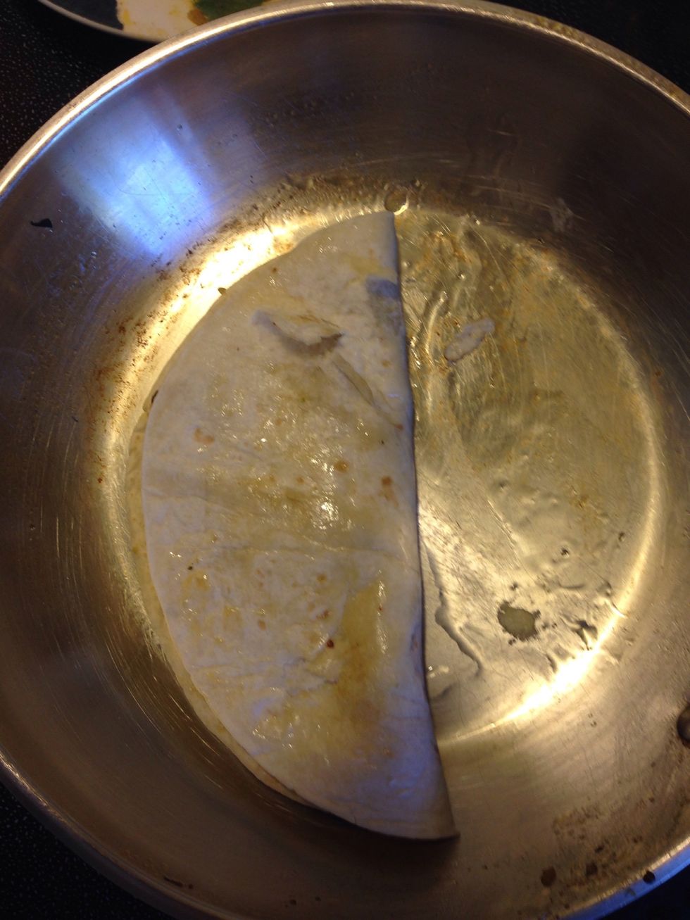 Fold over tortilla! Make sure you don't use much oil it will be too soggy! I almost over did it here! Allow your tortilla to brown as you like.