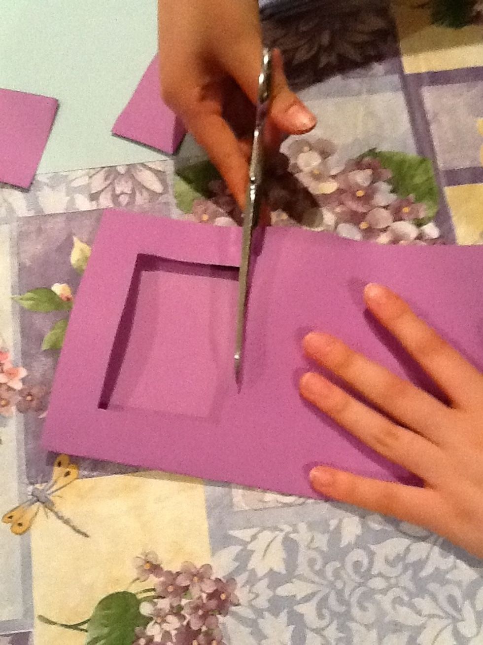 Fold over two sheets of paper in half and use the scissors to cut a shape (any shape really, heart, circle, etc.) in the middle of one half, about an inch from the sides. Leave alone the other sheet.