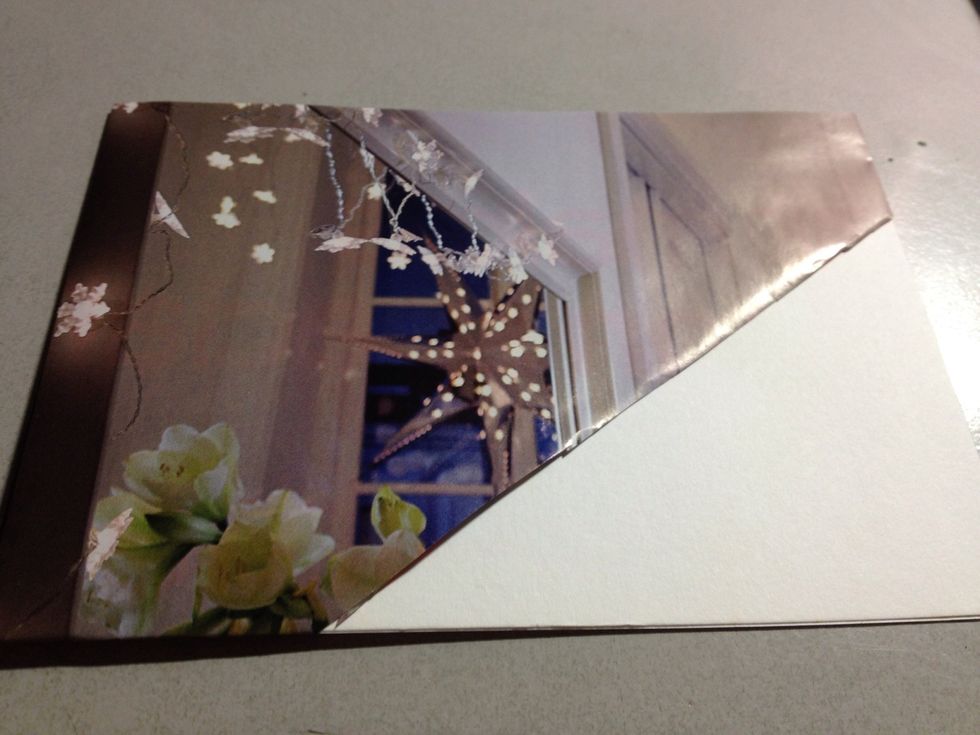 Fold over your card stock to see how you want to fit it onto your card. Trim the picture accordingly.