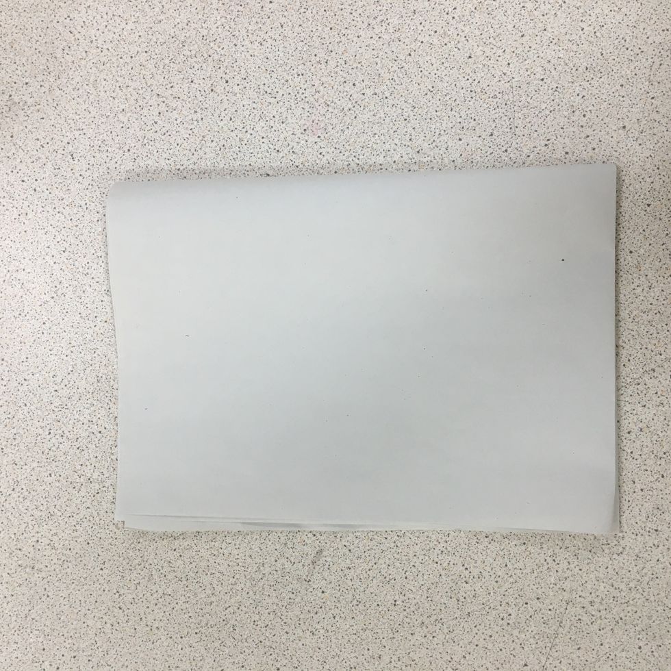 Fold paper in half again.