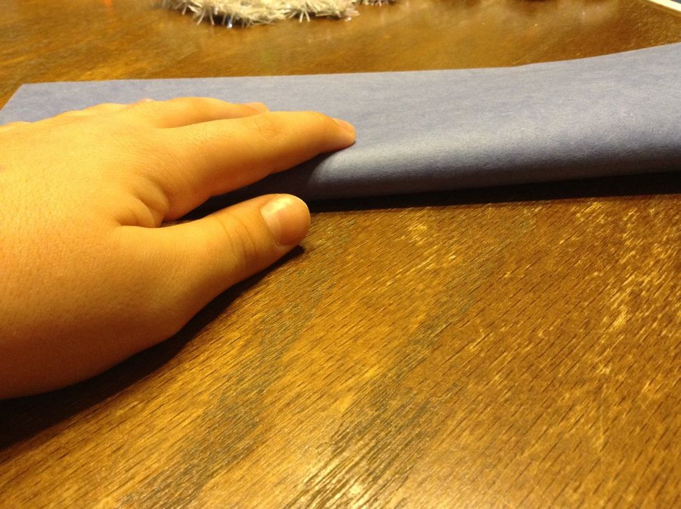 Fold paper in half long ways