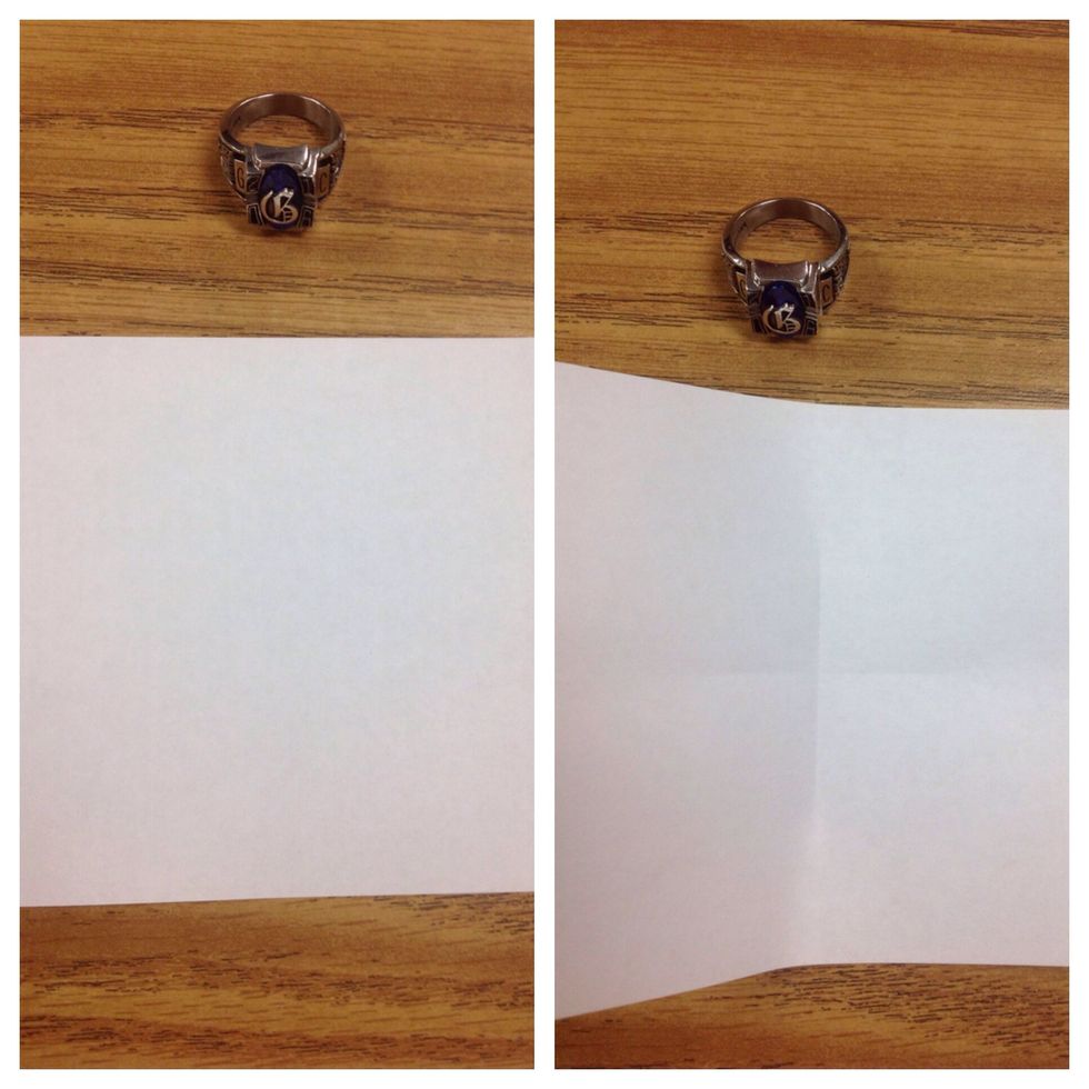 Fold paper in half the horizontal and vertical axis but instead of creasing the entire length of the paper, make a small crease in the center only.
