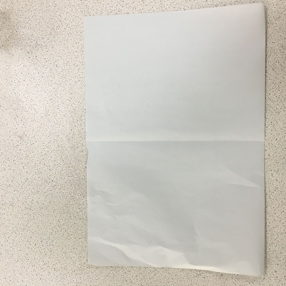 Fold paper in half.