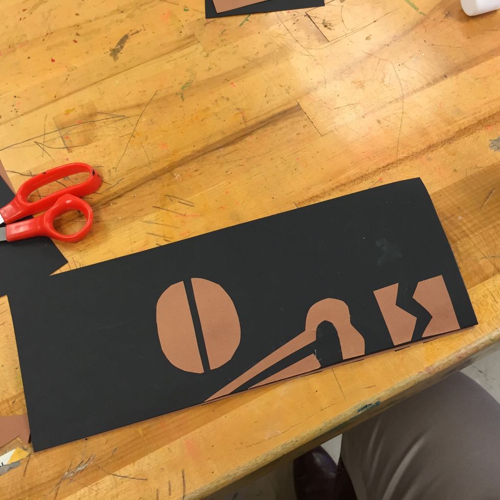 Fold paper in half.