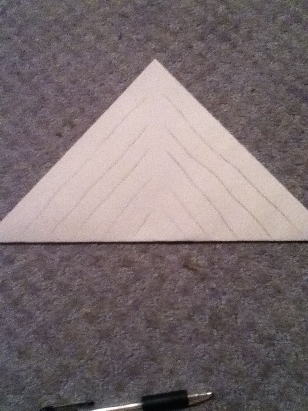 Fold paper so you have a triangle and then draw diagonal lines. Make sure the lines do NOT meet to a point
