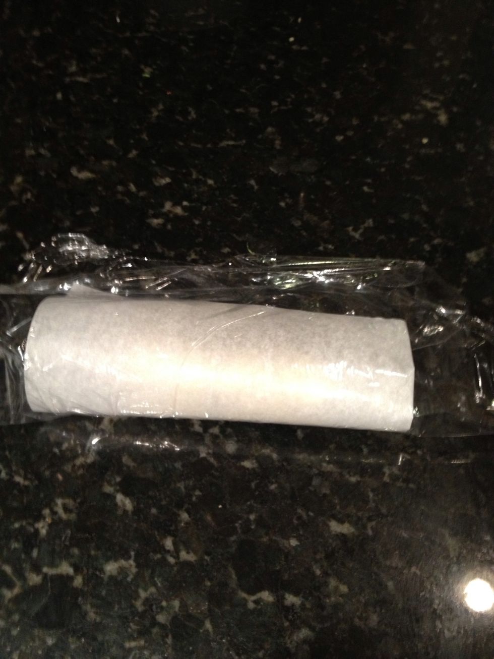 Fold parchment and plastic wrap over.