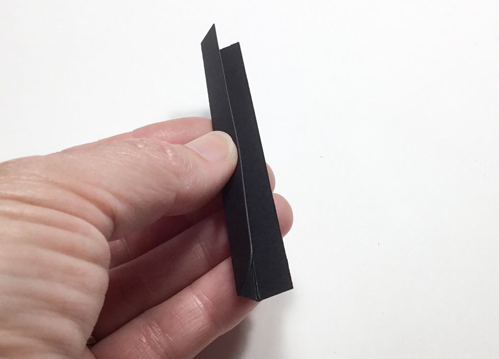 Fold pieces as shown. These will become like the spine of the pages and allow the pages to fold concertina style.