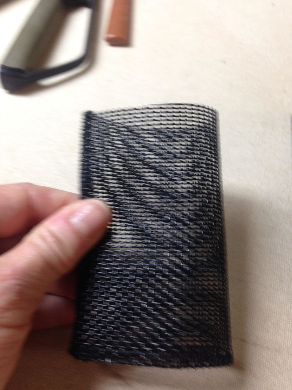 Fold pocket in half vertically and insert into 2-hole punch.  Sorry for this fuzzy pic :(