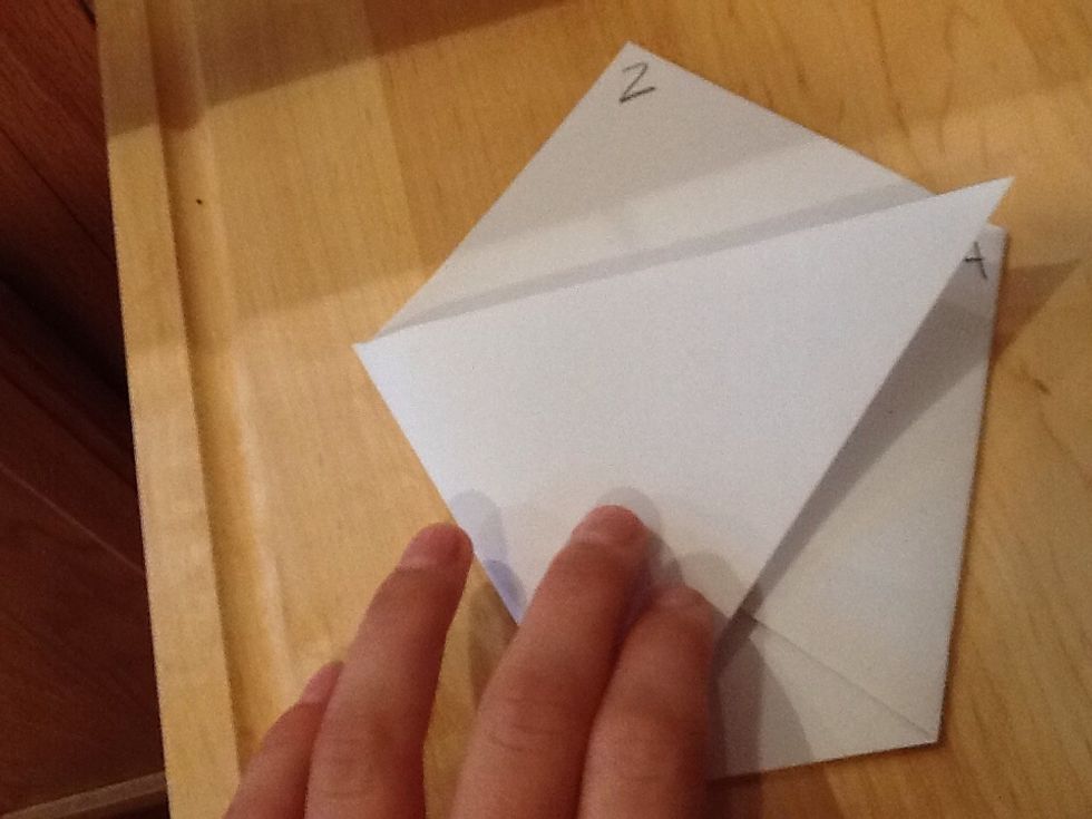 Fold point 1 to point 4.