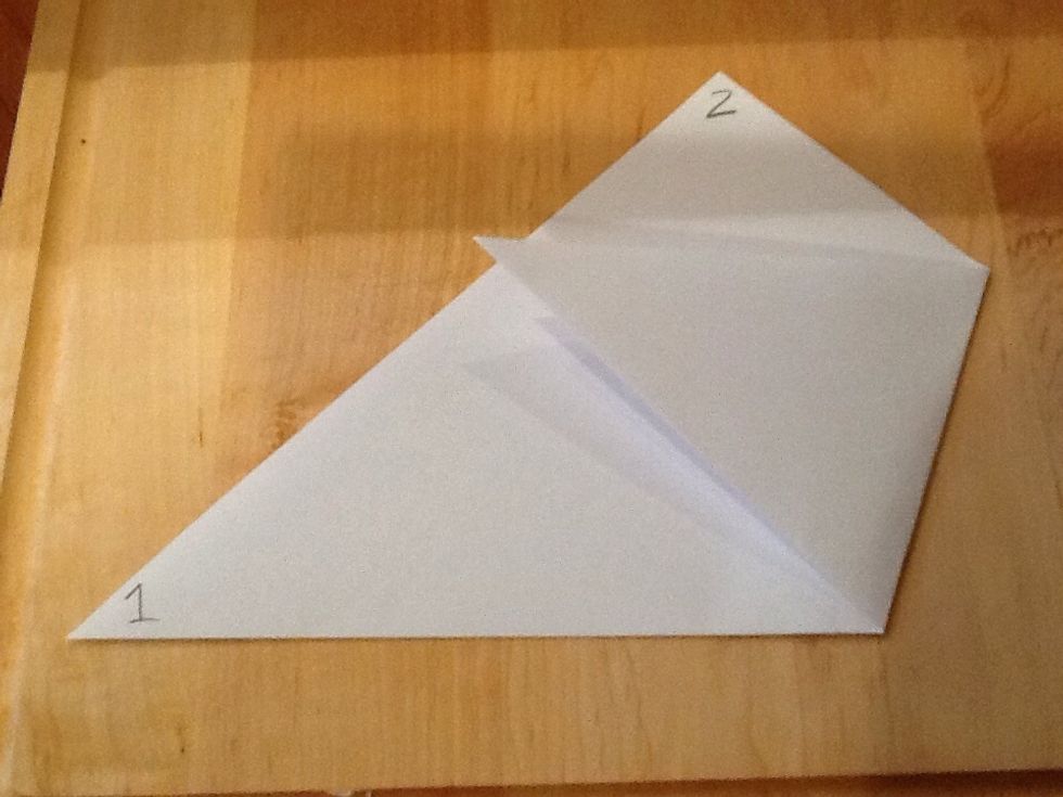 Fold point 3 to the edge of 1 and 2, so that the top edge of the fold is parallel to the bottom of the main triangle.