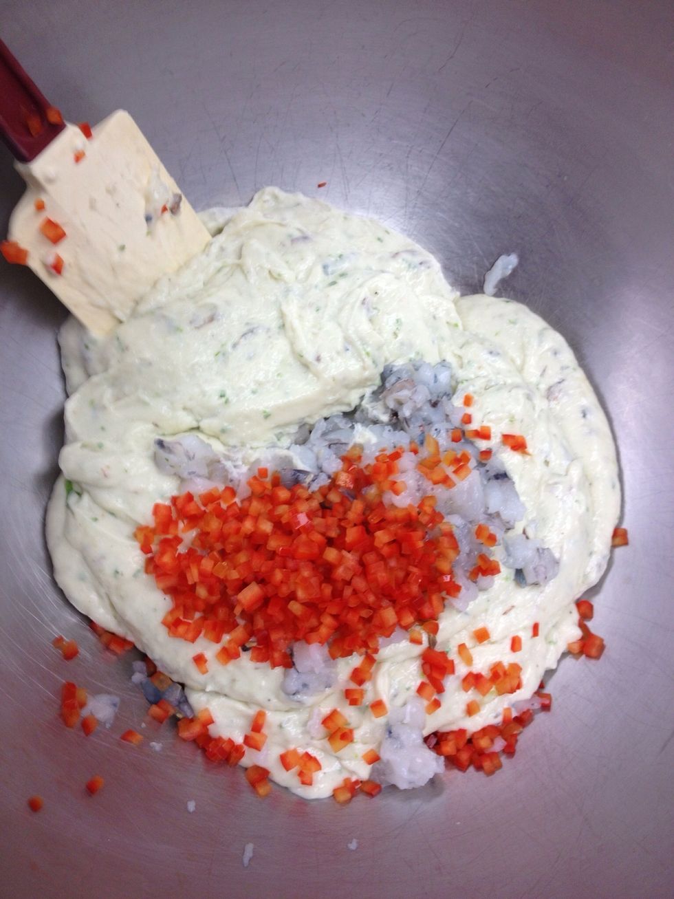 Fold remaining chopped shrimp and red pepper into the mousse.