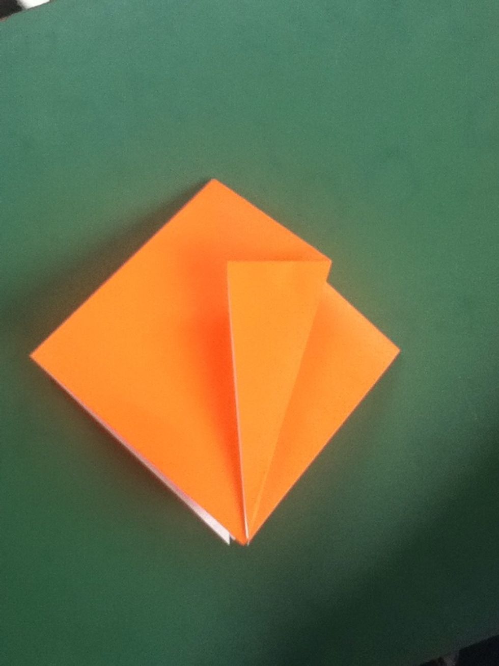 Fold right side of top layer to the center crease