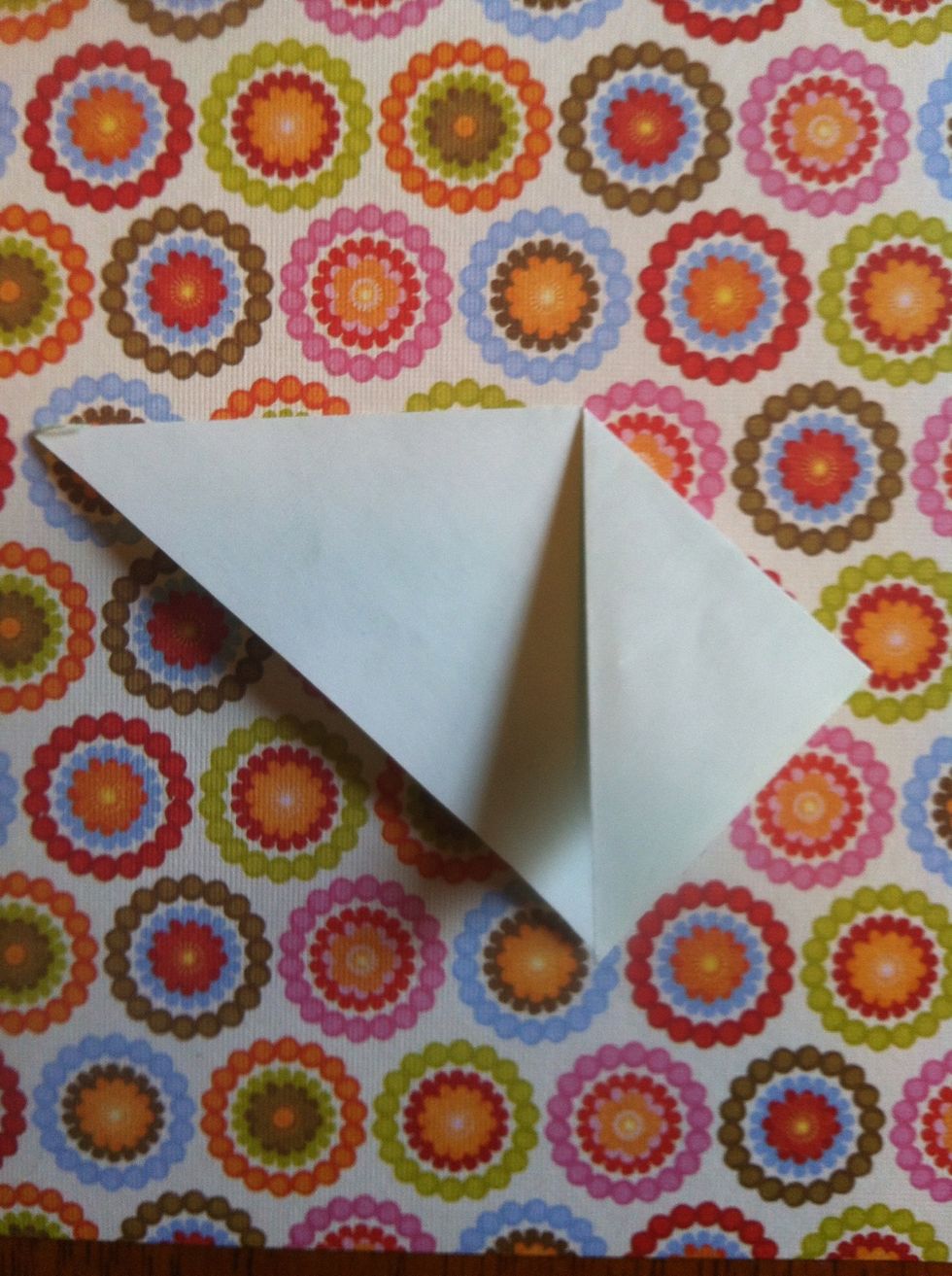 Fold right tip down to bottom point.