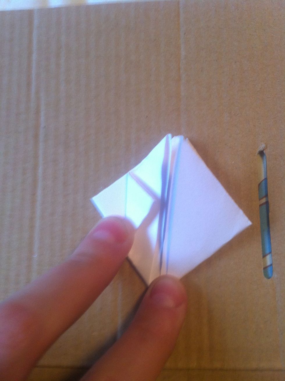 Fold side corners into center