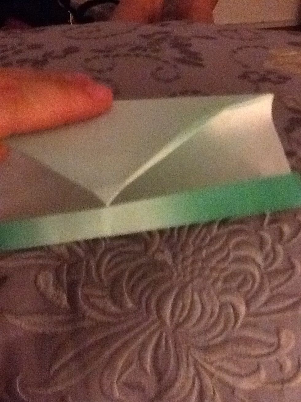 Fold so the tip at the top is just at the end of the bottom.