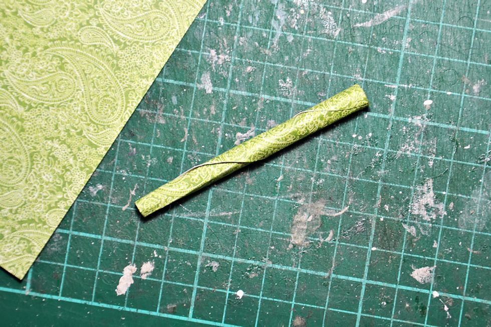 Fold some green patterned paper to create the pumpkin stem.