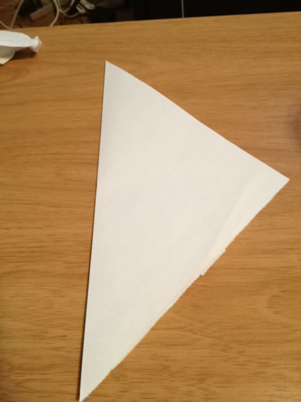 Fold square in half.