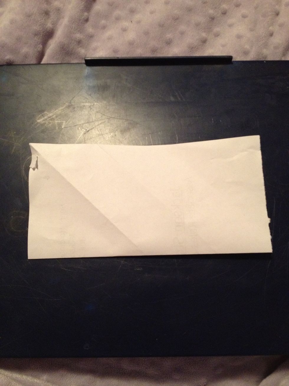 Fold square in half.