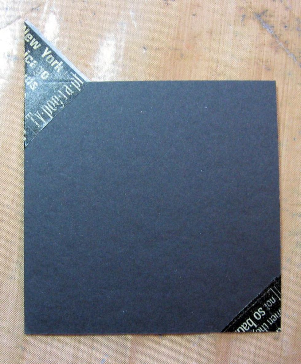 Fold tape over the corner as seen here, or trim with scissors. I like folding as it adds a little more dimension to the matted photo.